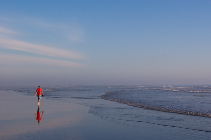 Sand, Sky, Water And Hiker